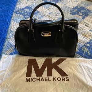 Beautiful Michael Kors black 3 compartment zipped satchel. Gold hardware.